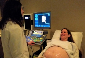 Pregnant woman having ultrasound at Madison OBGYN clinic