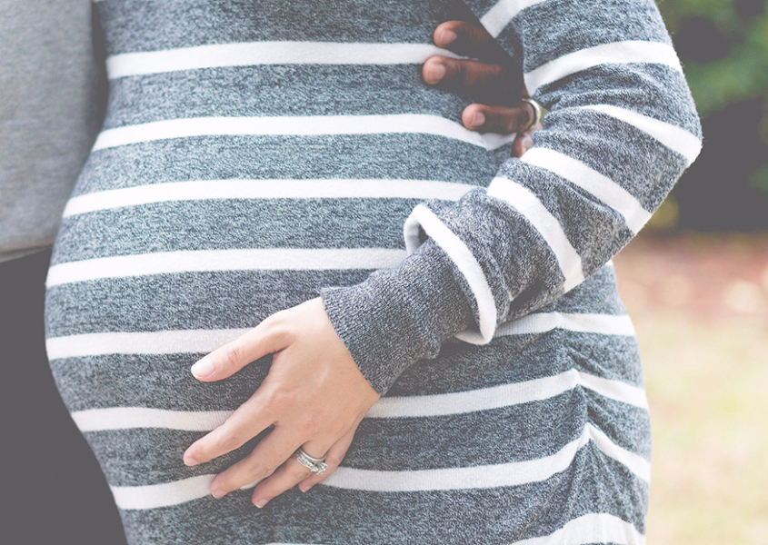 Pregnant Woman holding belly