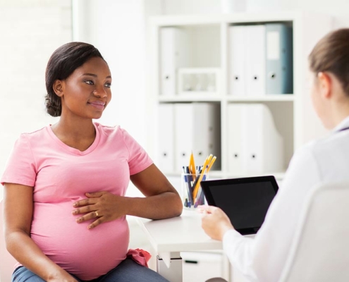 Getting Pregnant: Woman at Madison OBGYN discussing pregnancy
