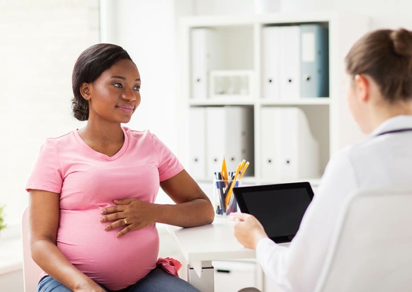 Getting Pregnant: Woman at Madison OBGYN discussing pregnancy