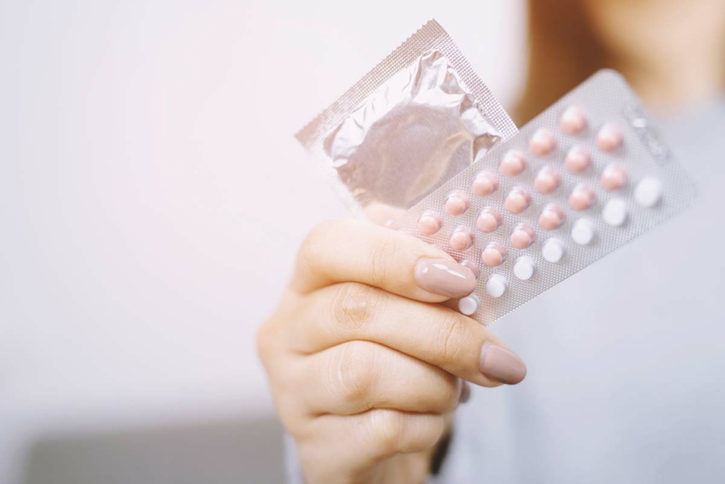 How To Stop Your Period With The Pill Or IUD, According To Gynos