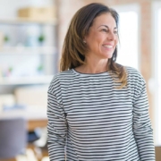 Woman smiling and being treated for hormone imbalances