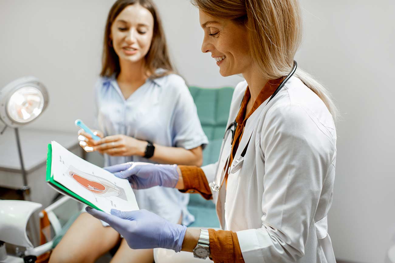 Female OBGYN doctor talking to patient