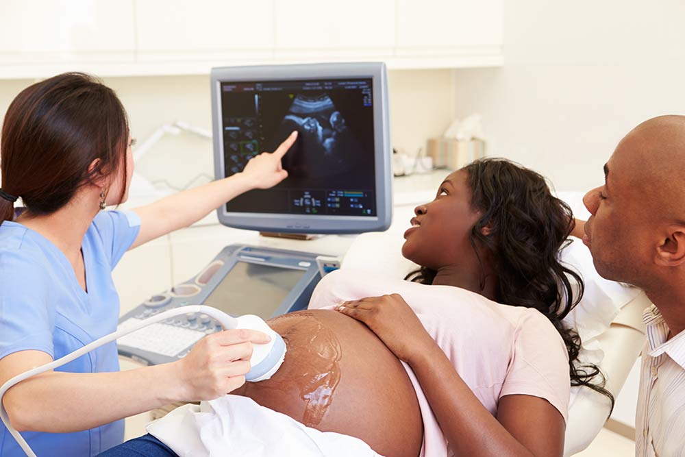 Woman getting ultrasound at OBGYN clinic