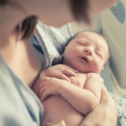 First-time mom holding newborn baby after giving birth