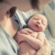 First-time mom holding newborn baby after giving birth