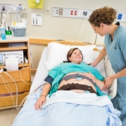 Woman smiling after getting an epidural during labor