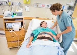 Woman smiling after getting an epidural during labor