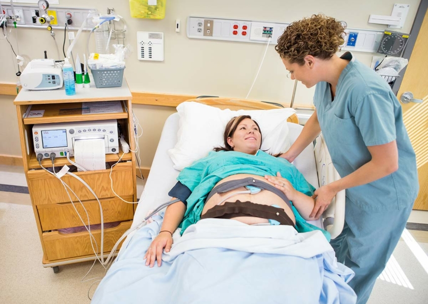 Woman smiling after getting an epidural during labor