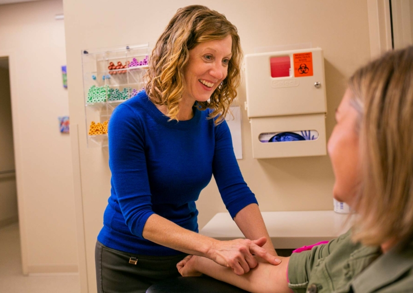 Smiling Madison Women's Health provider with patient