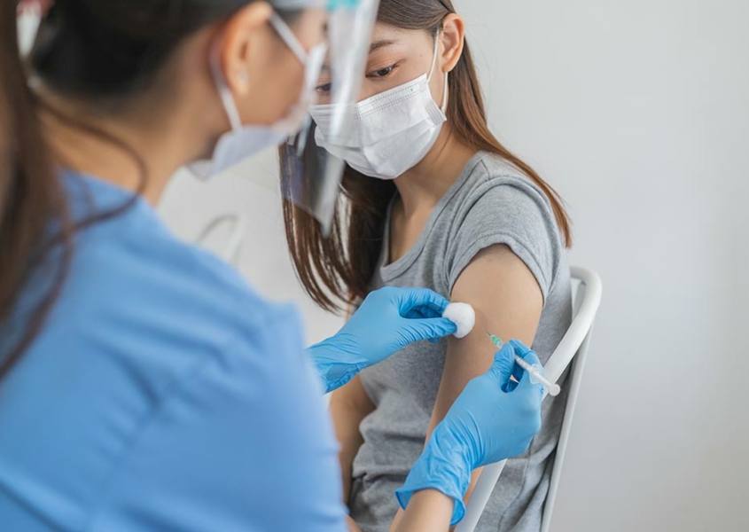 woman receiving a vaccine