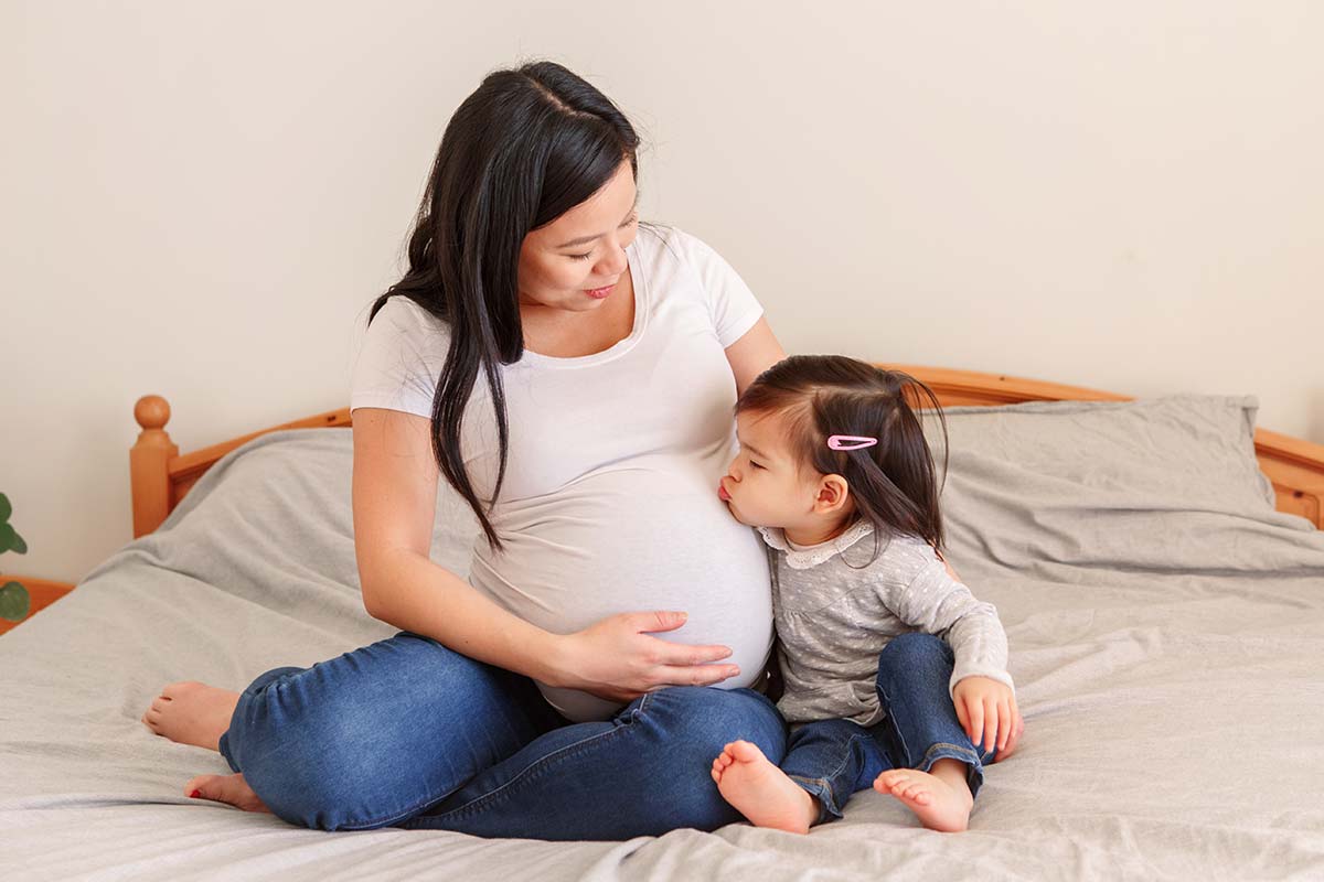 Pregnant Mother with Daughter, Pregnancy Belly of Woman with Child