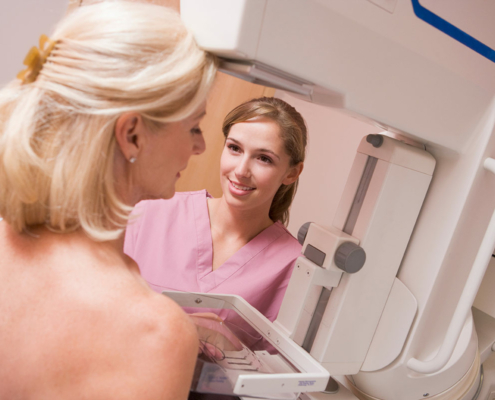 Provider giving woman a mammogram