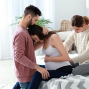 Pregnant couple with doula at home