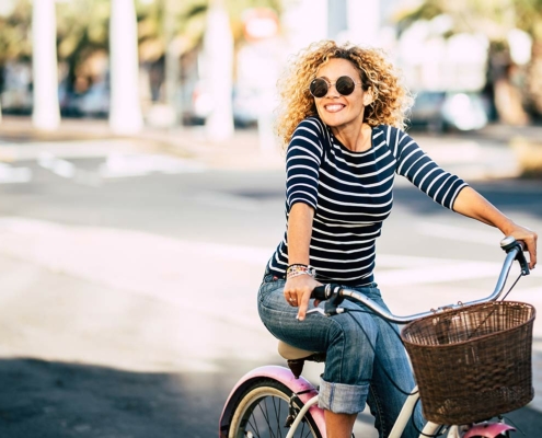 Woman riding a bike after overcoming yeast infections during pregnancy